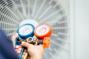 Air Conditioning Technician performing air conditioning maintenance