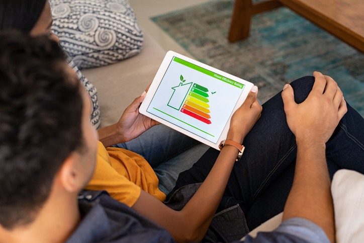 people checking their home's efficiency on a tablet