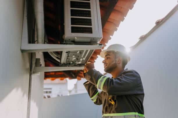 HVAC specialist performing ductwork inspection and cleaning