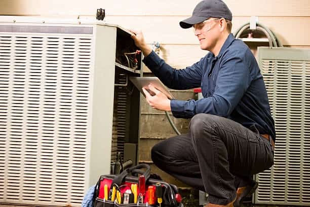 Expert Home Service technician repairing residential furnace