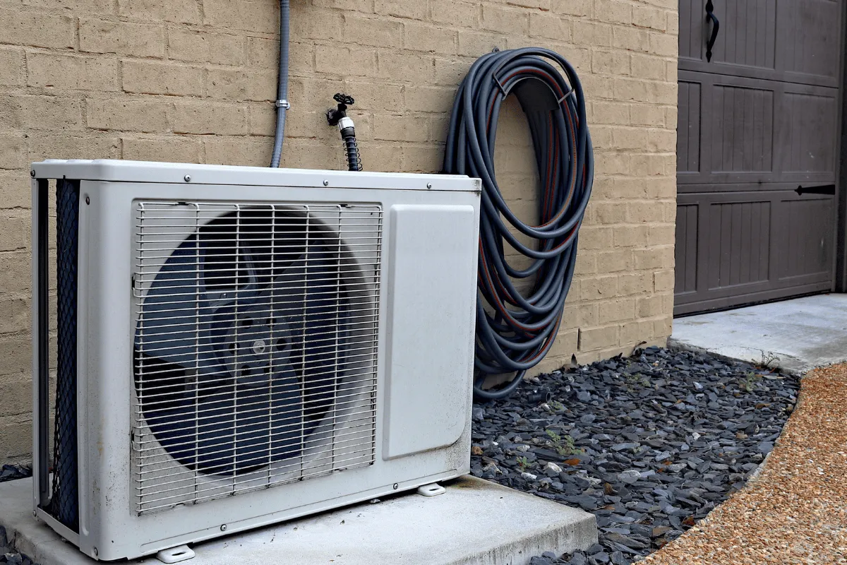 Outdoor ductless mini-split condenser mounted beside a home, serviced by an HVAC contractor in Hillsborough County, FL